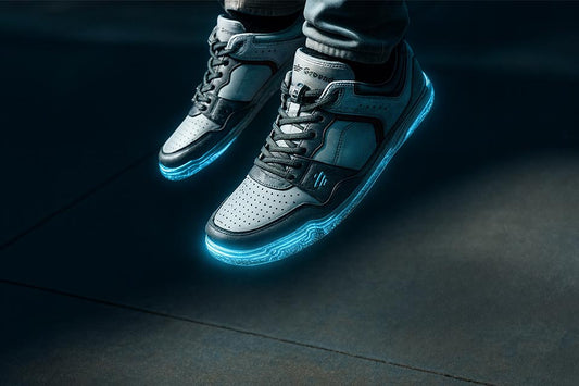 What Are Grounding Shoes? AIONS floating and soles lit up in neon blue